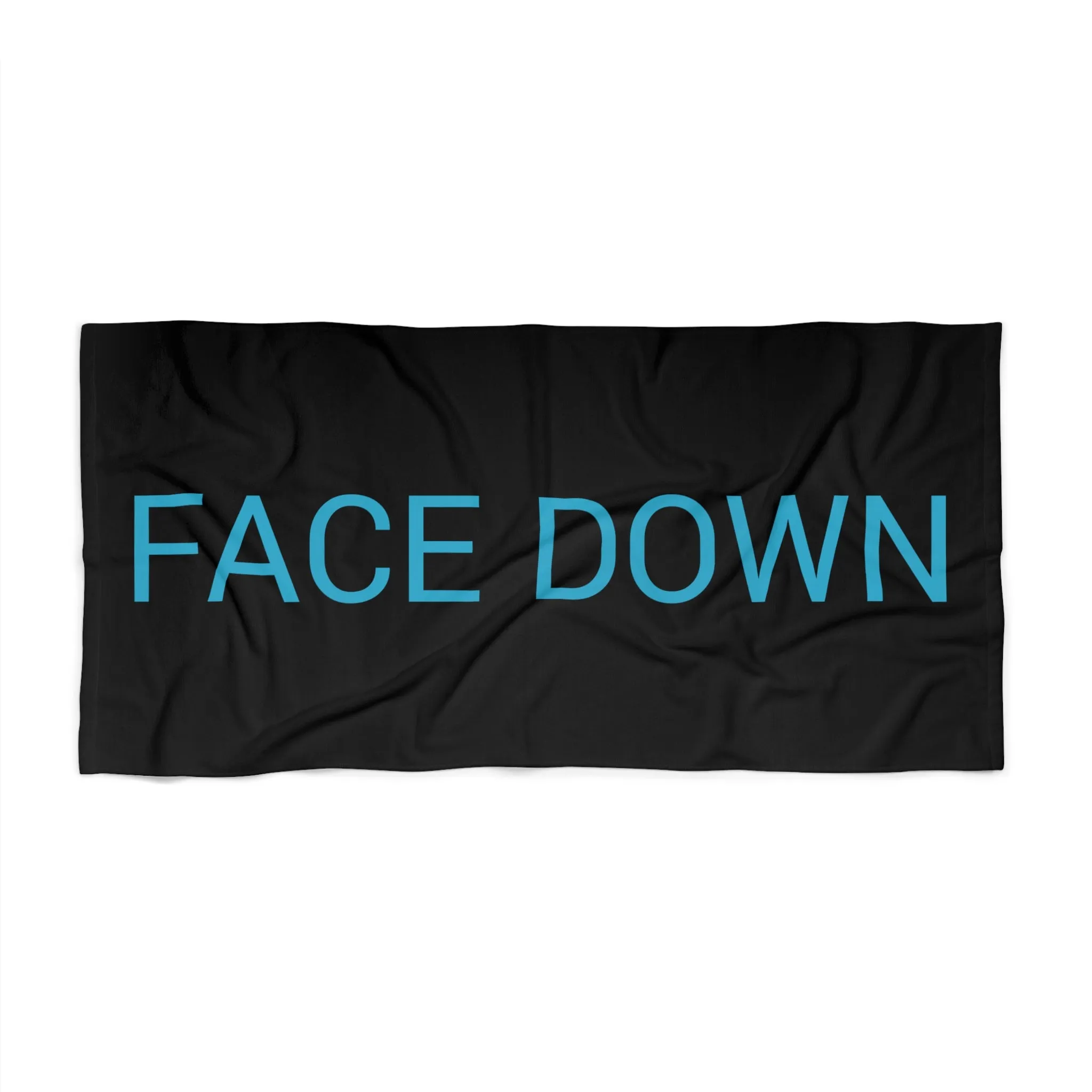 Face Down Beach Towel by CULTUREEDIT