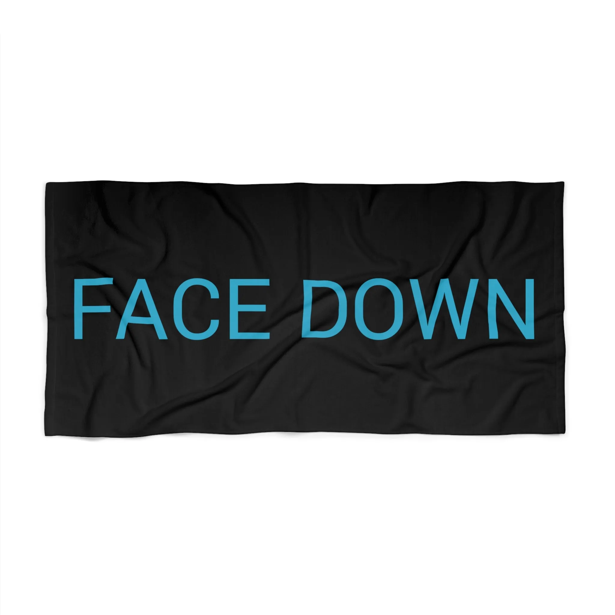 Face Down Beach Towel by CULTUREEDIT